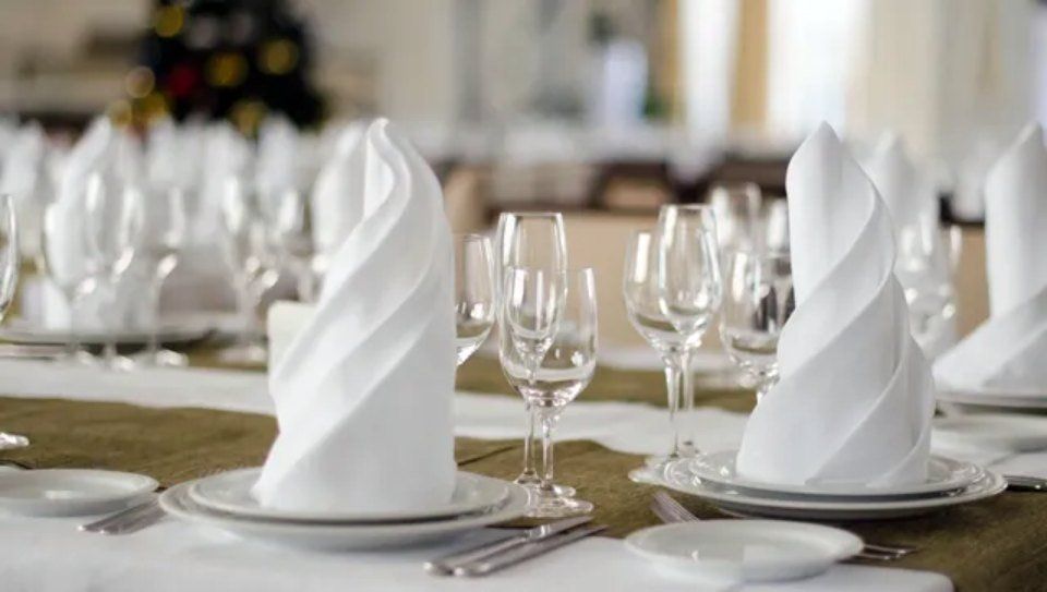 table with cotton tablecloth and napkins