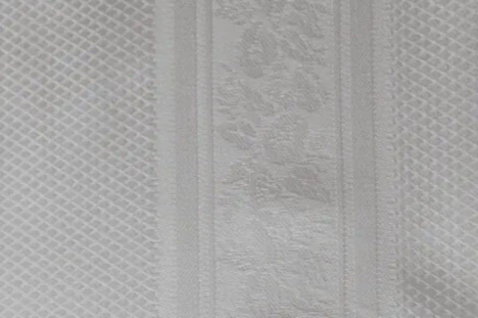 white towel with floral embroidery