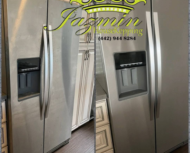 Stainless steel French door refrigerator with water and ice dispenser, branded with a cleaning company logo.