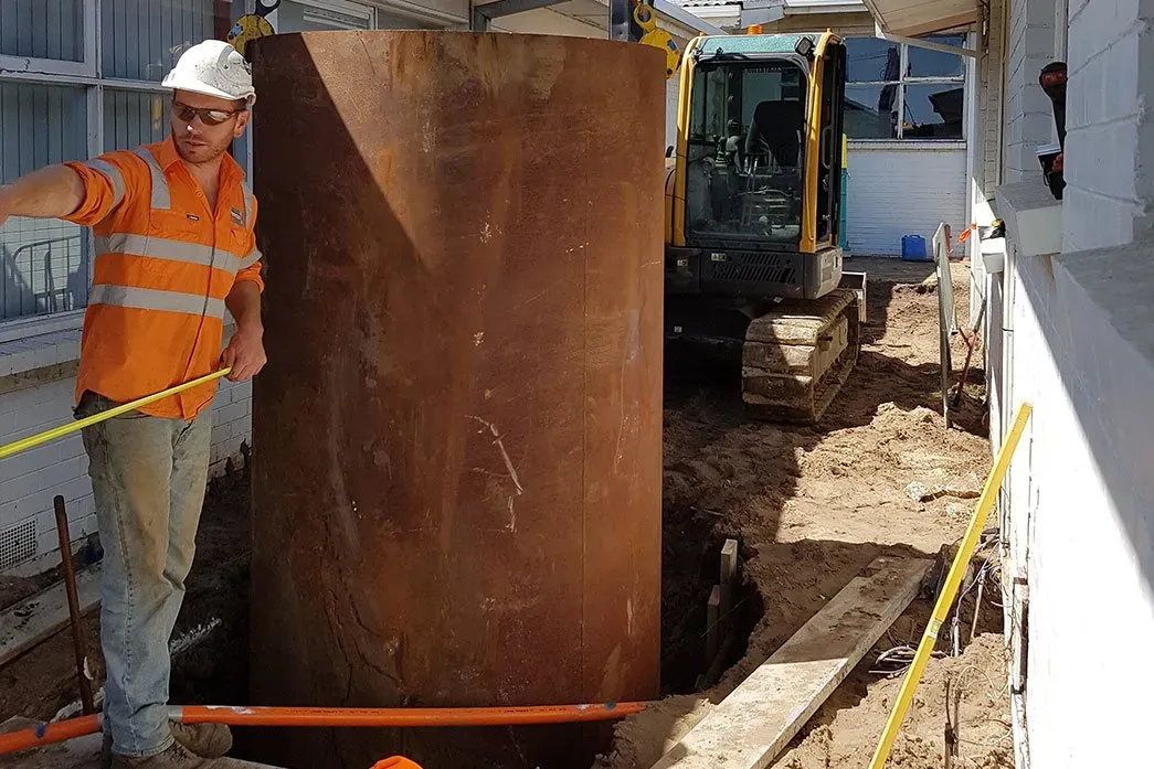 Man Beside the Casing — Toorak, VIC — A Access Piling and Rock Drilling Man Beside the Casing — Toorak, VIC — A Access Piling and Rock Drilling