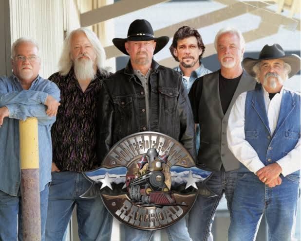 A group of men standing in front of a sign that says Confederate Railroad