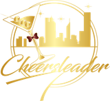 Gold cheerleader logo with skyline, megaphone, and cursive &ldquo;Cheerleader&rdquo; text