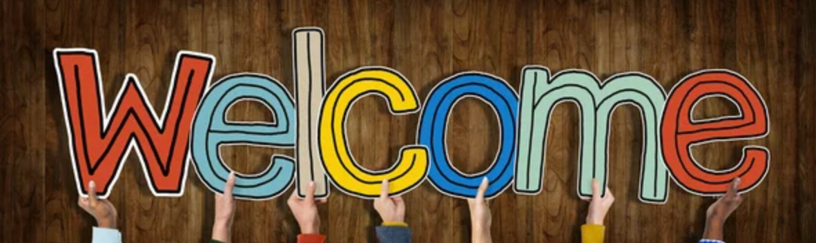 People holding up the colorful letters of 