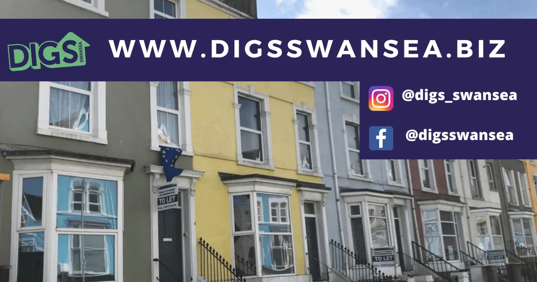 Row of colorful houses, with a banner reading 