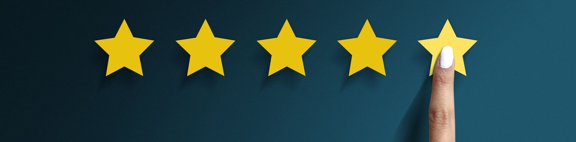 Hand touching a yellow star, rating five stars. Dark blue background.