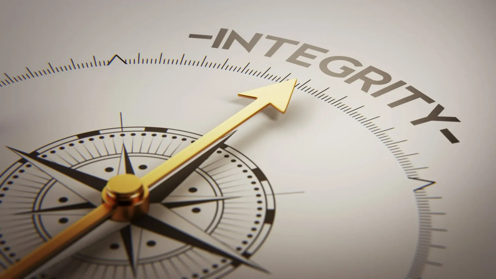Compass and gold arrow pointing toward the word “INTEGRITY” on a beige background.