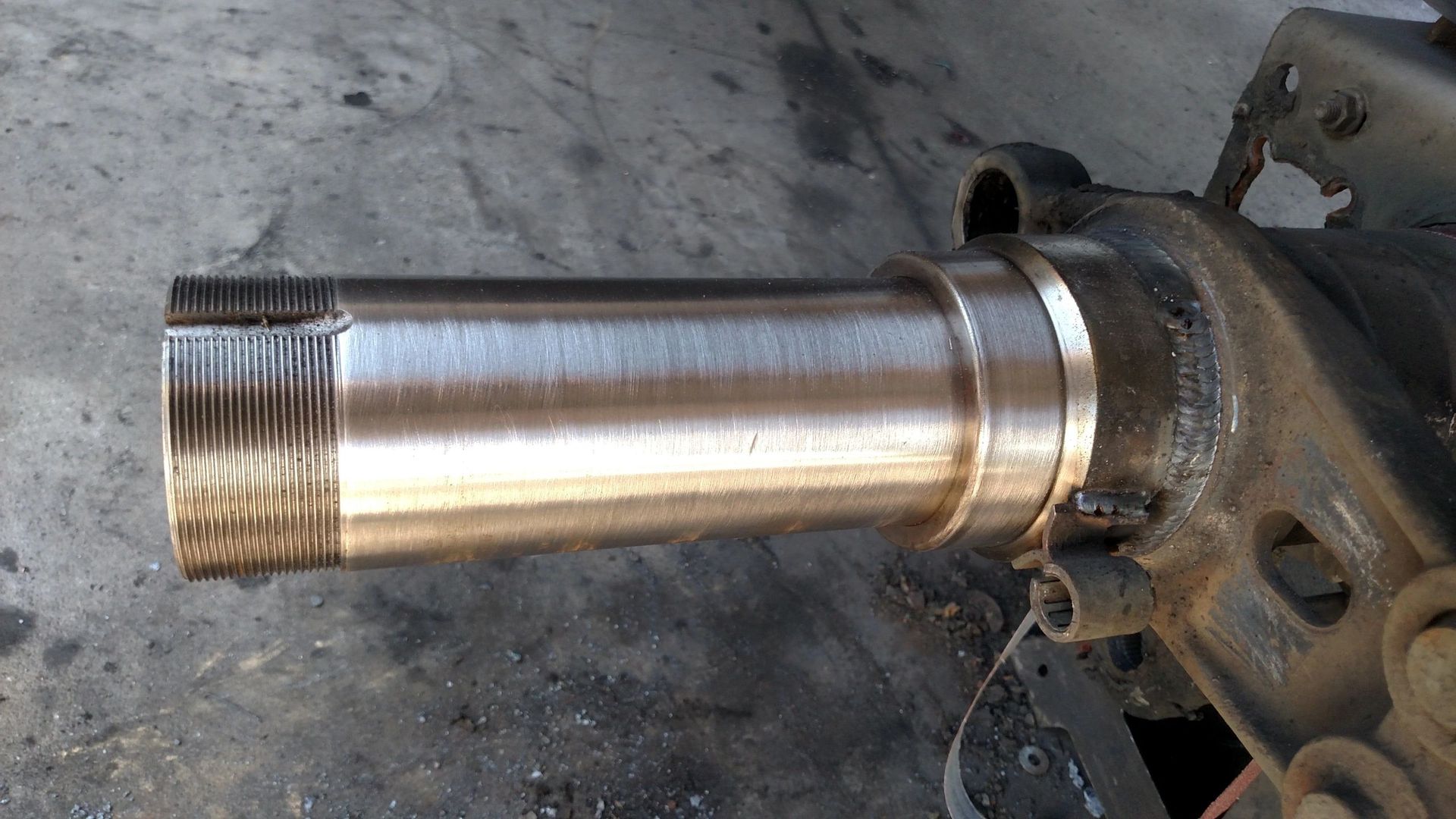 A close up of a metal pipe on the ground