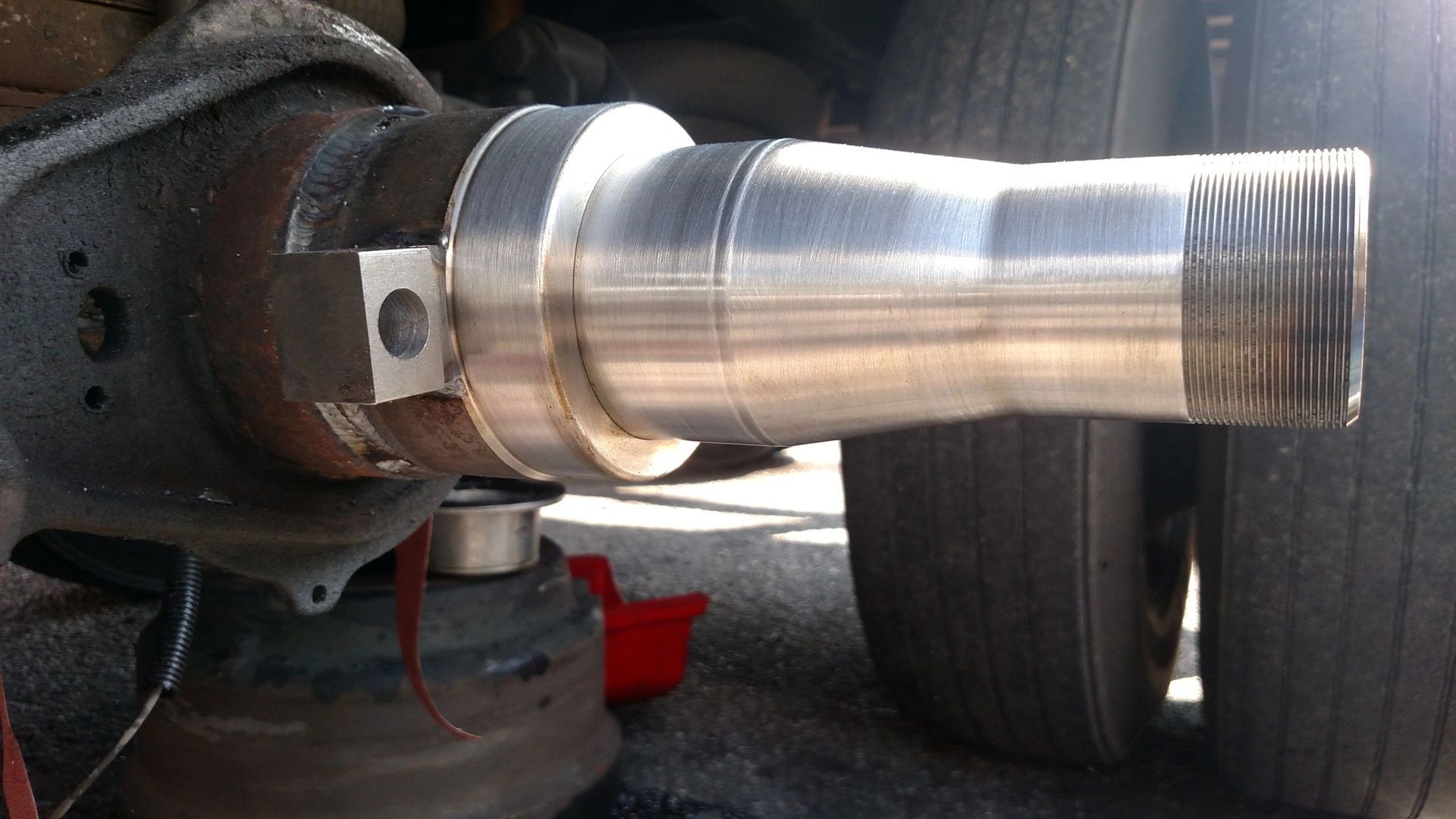 A close up of a metal pipe on a vehicle