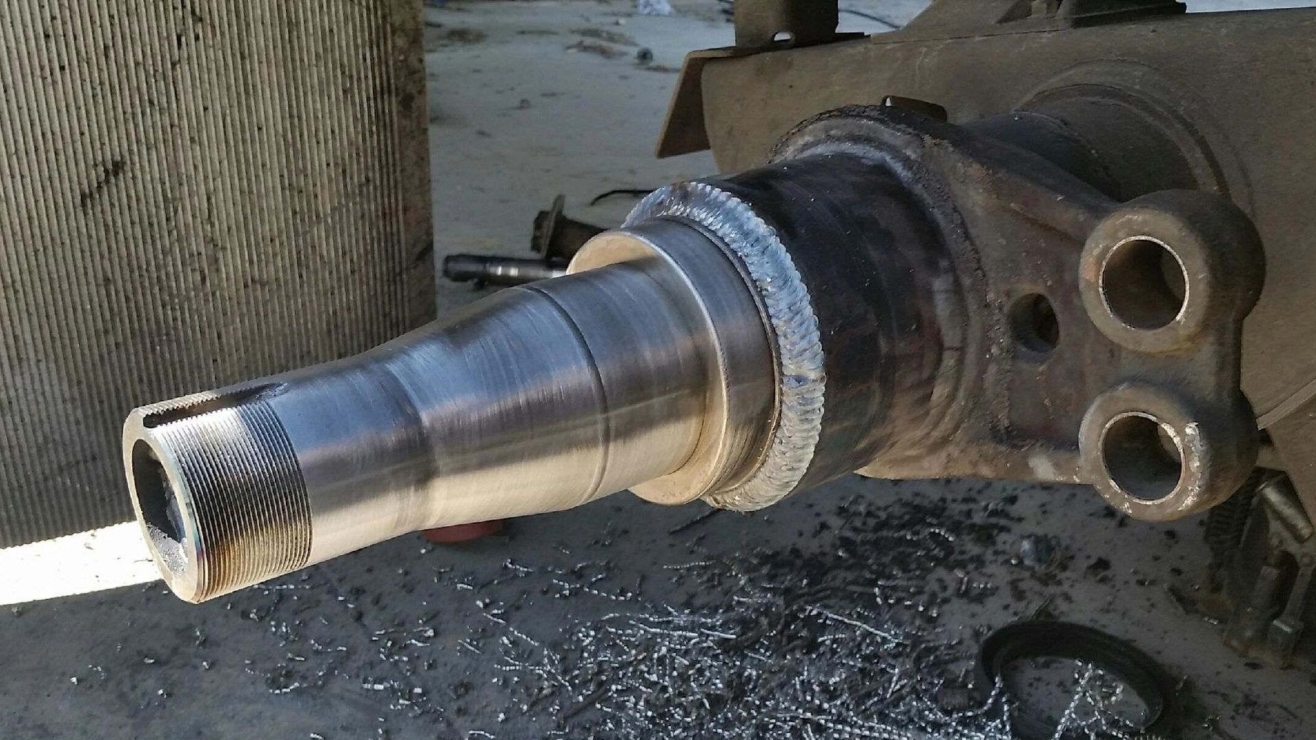 A close up of a metal object with two holes in it