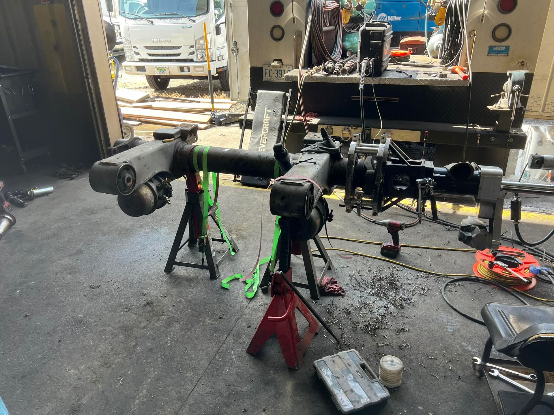 A truck is being worked on in a garage.