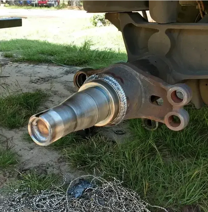 A close up of a metal object in the grass