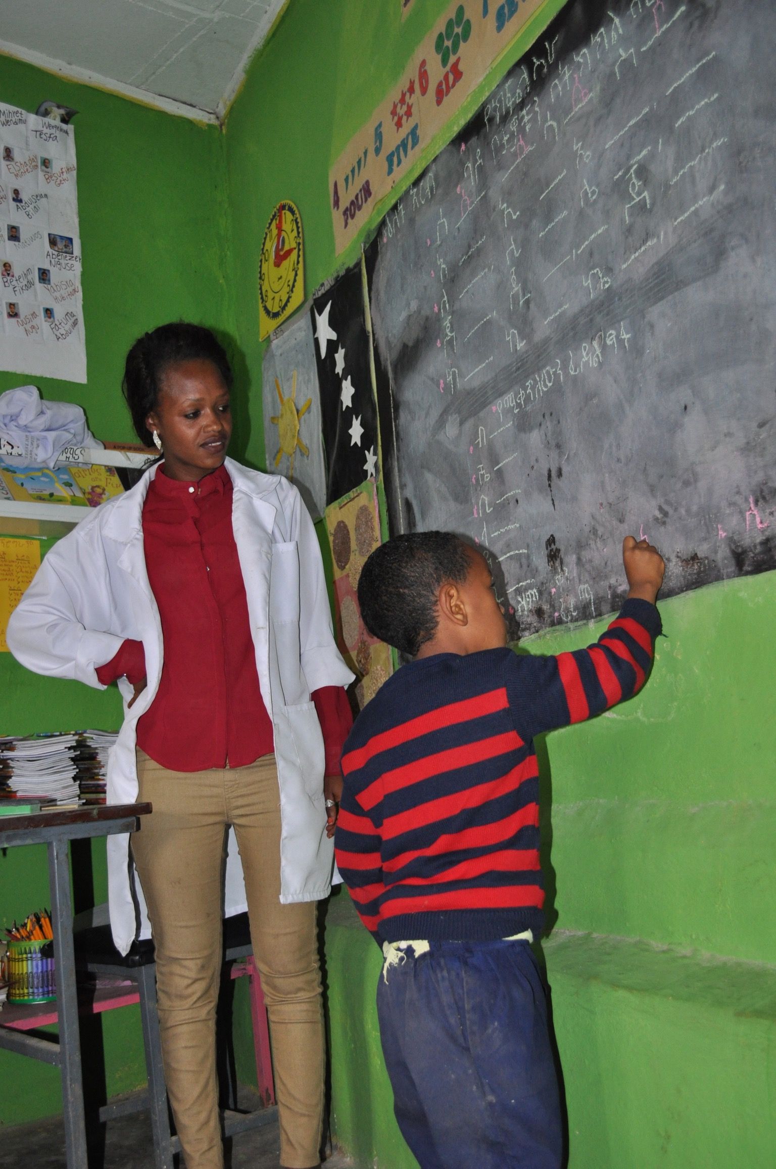 OneLove team serving the members of the community in Ethiopia and meeting the students