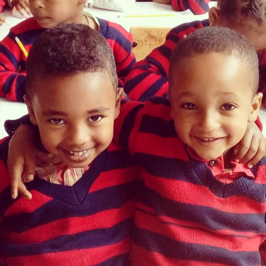 OneLove Ethiopia students smiling. One Love helps provide a safe education to students..