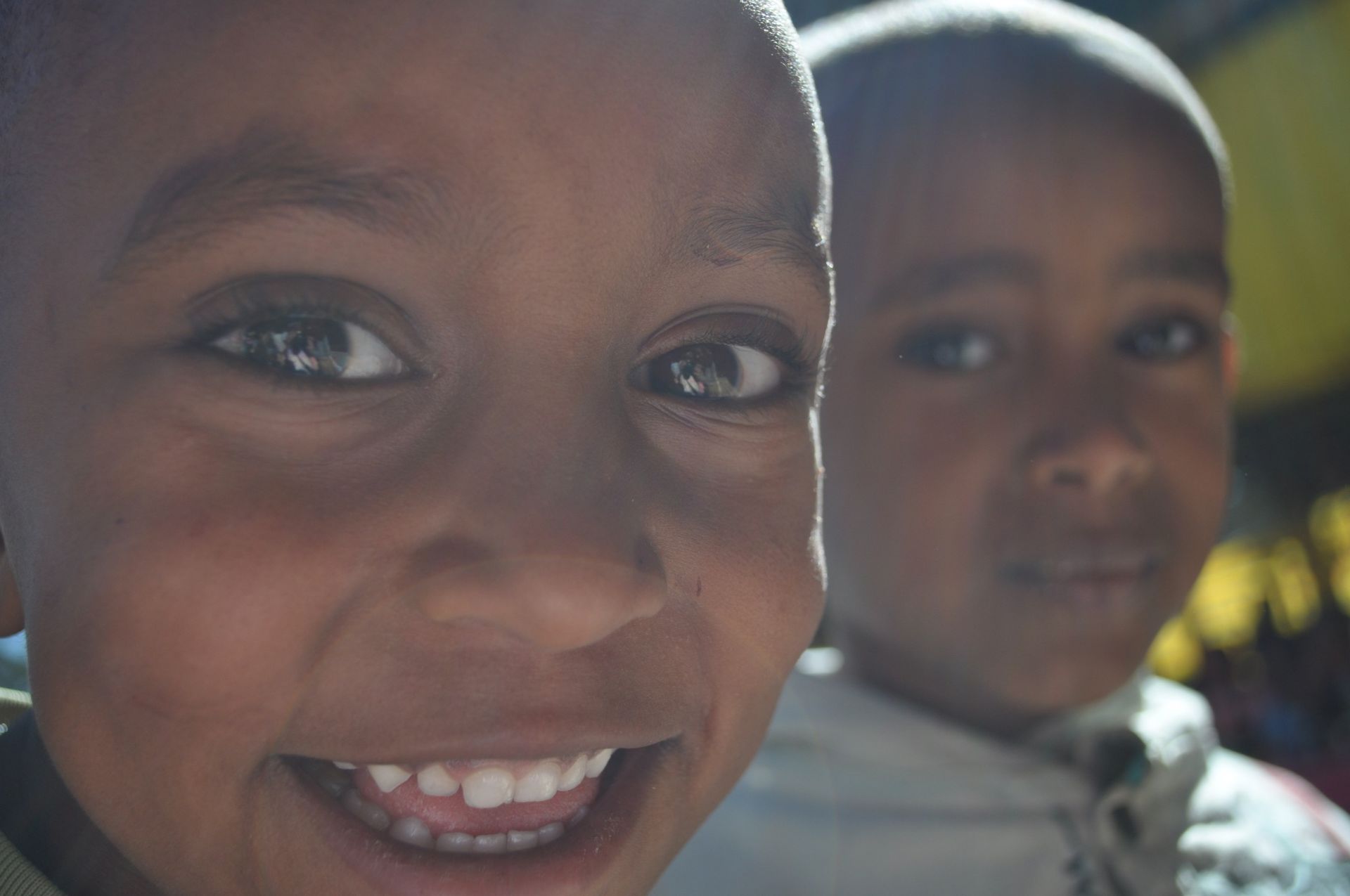 OneLove Ethiopia students smiling. One Love helps provide a safe education to students..