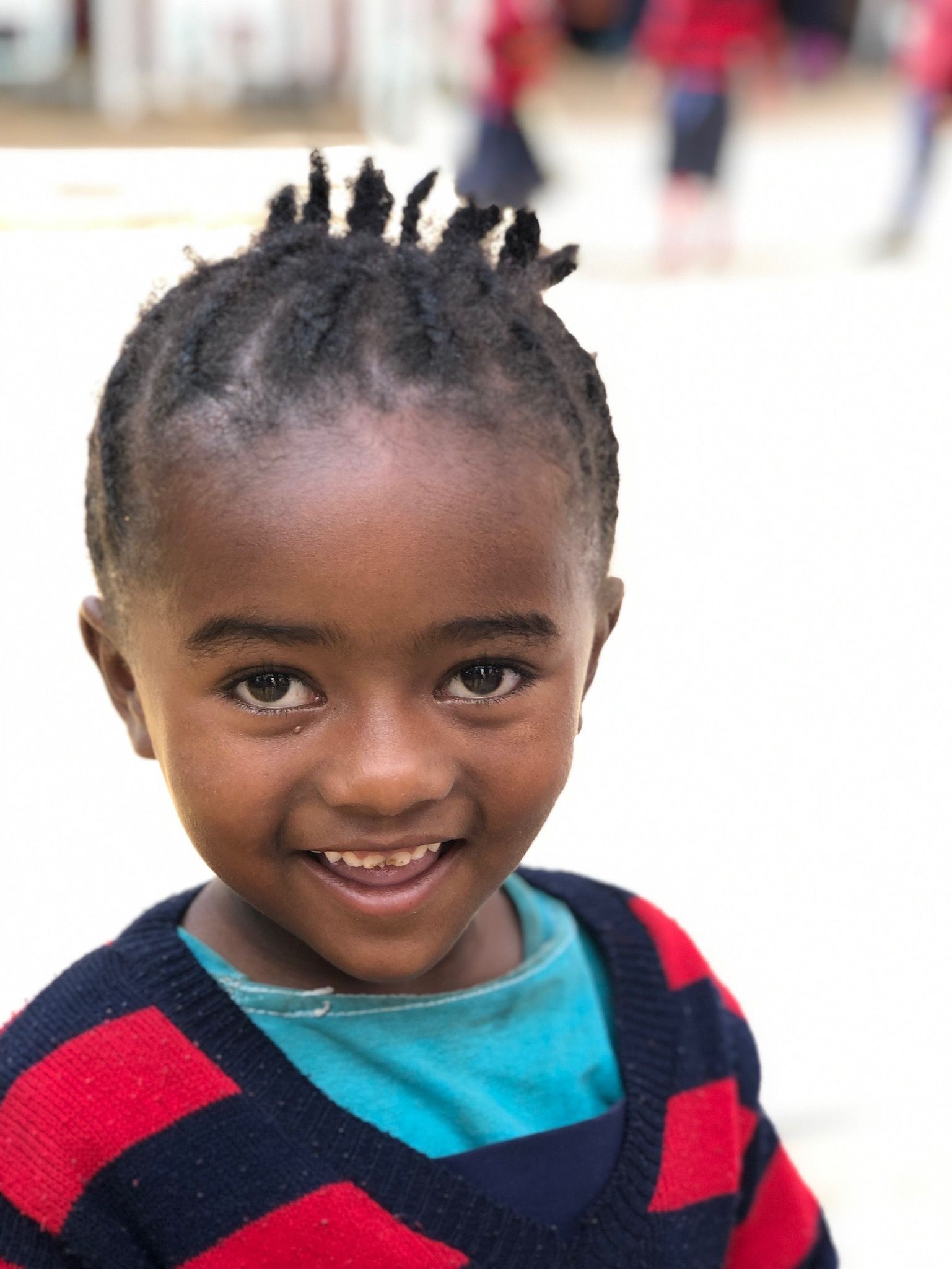 OneLove Ethiopia students smiling. One Love helps provide a safe education to students..