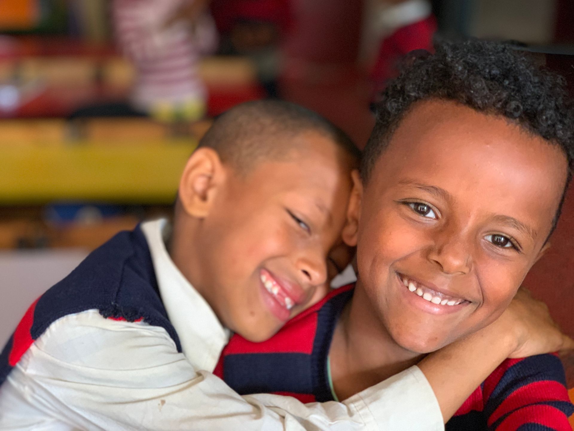 OneLove Ethiopia students smiling. One Love helps provide a safe education to students..