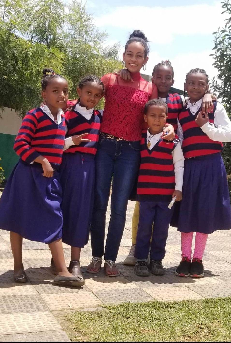 OneLove team serving the members of the community in Ethiopia and meeting the students