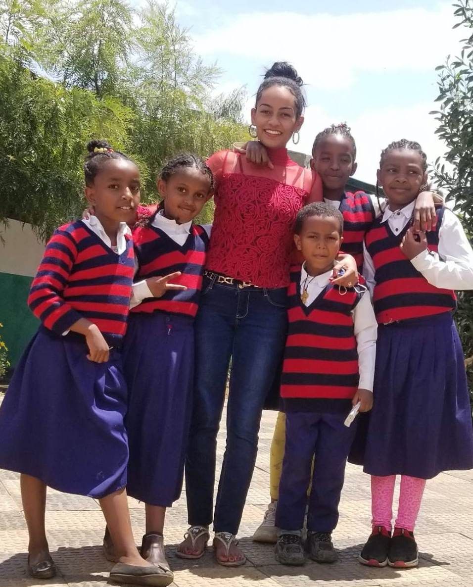 OneLove team serving the members of the community in Ethiopia and meeting the students