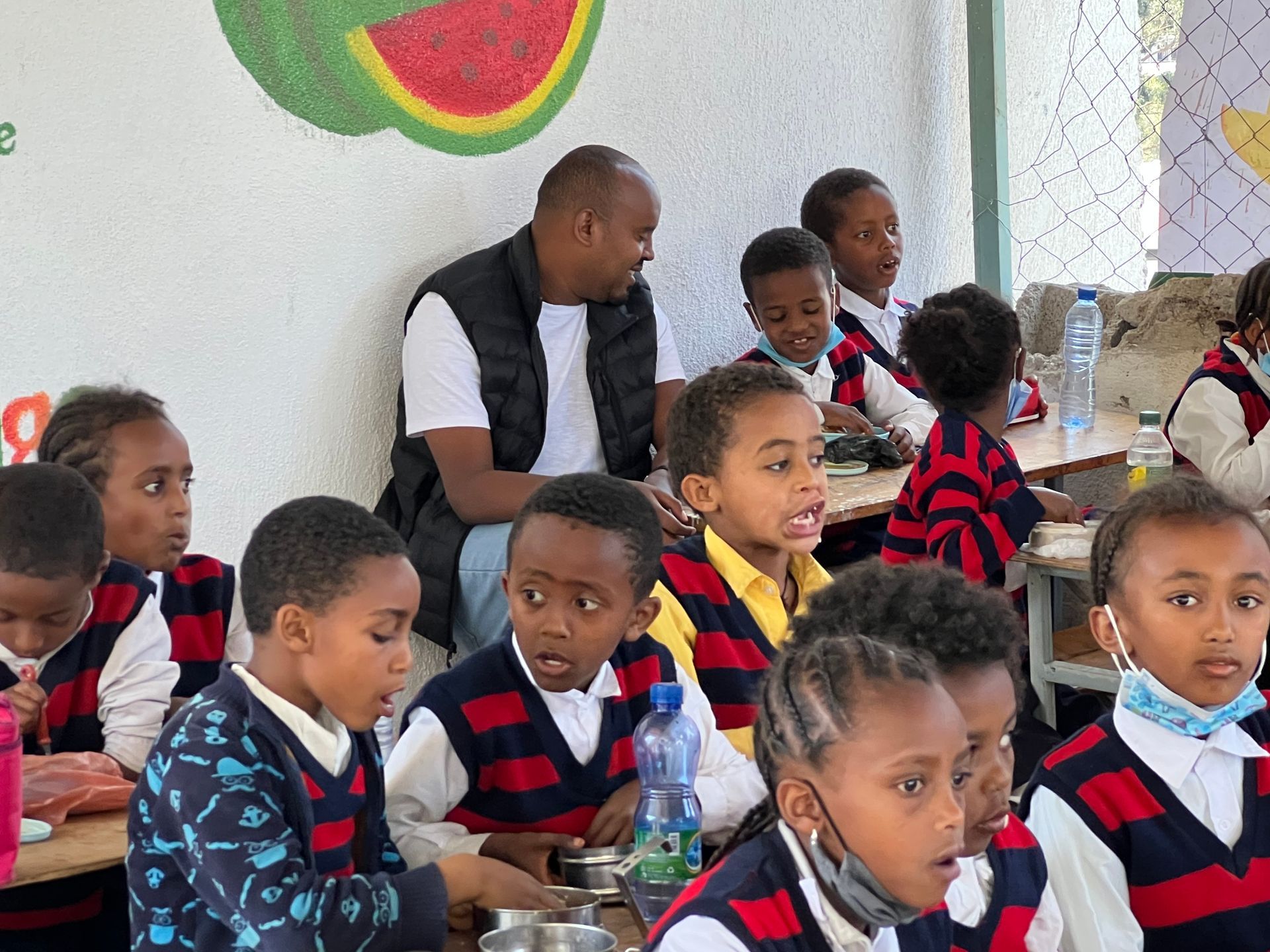 OneLove team serving the members of the community in Ethiopia and meeting the students