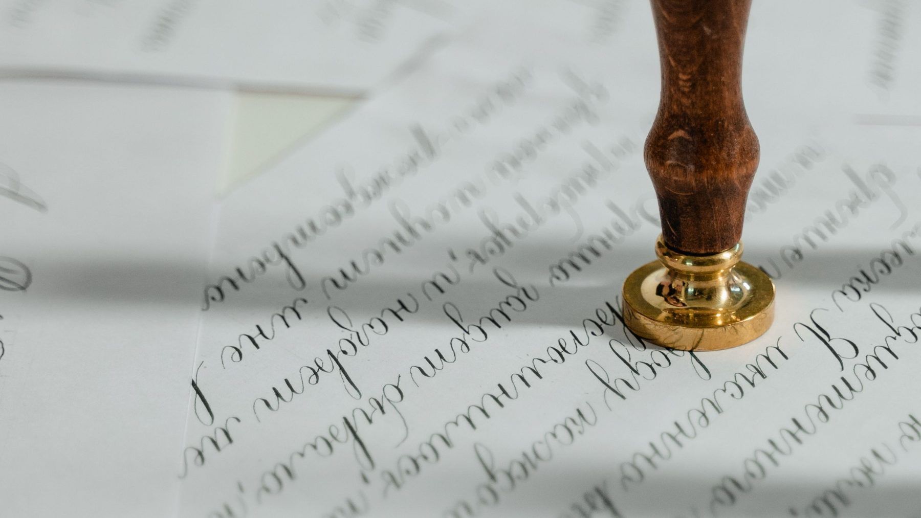 A handwritten document with a seal pressed into it