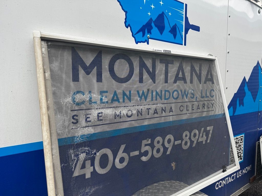 Montana Clean Windows LLC sign on a white vehicle, with phone number 406-589-8947