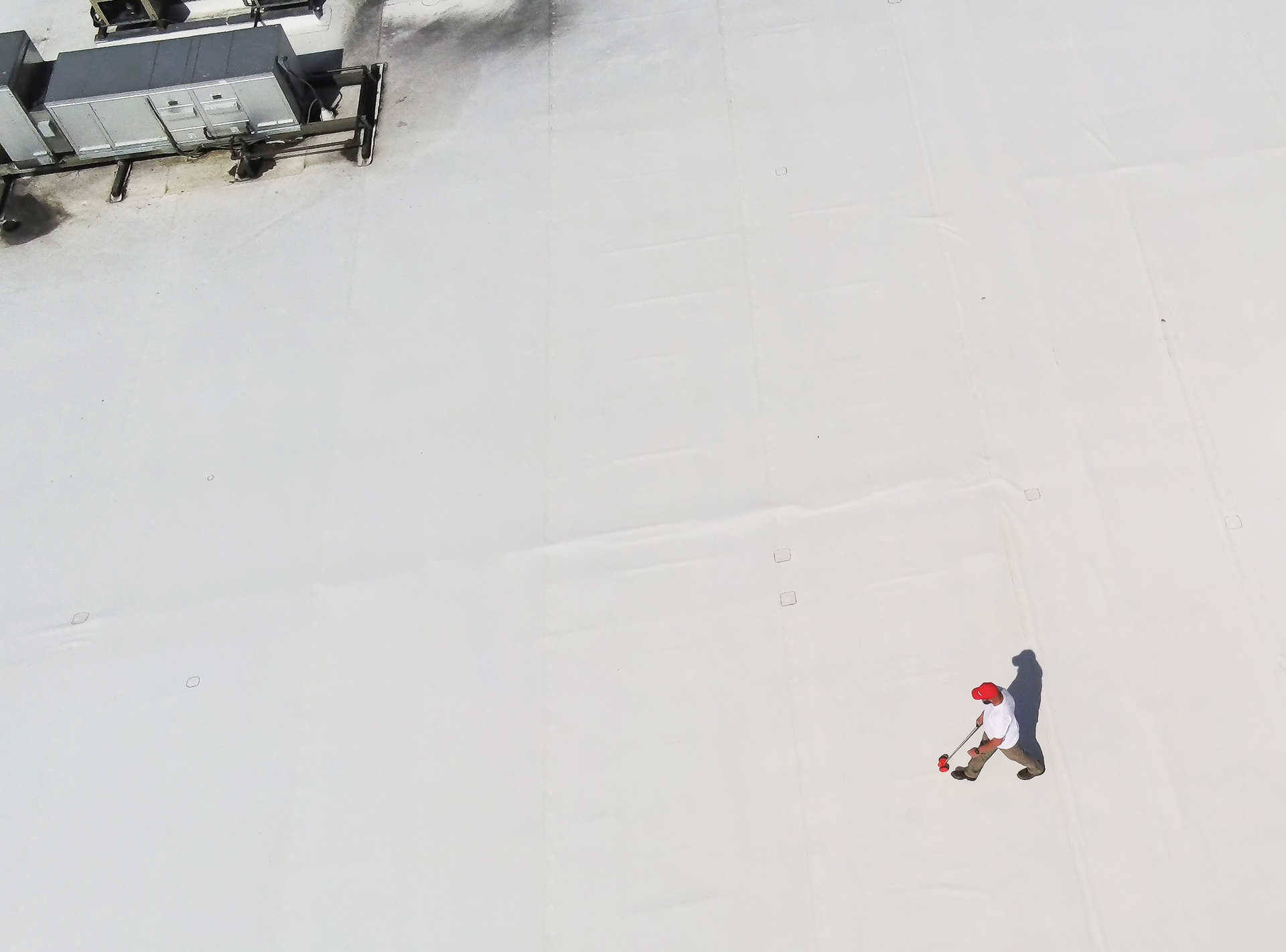 Commercial roof assessment documenting membrane condition, drainage, flashing, and moisture concerns