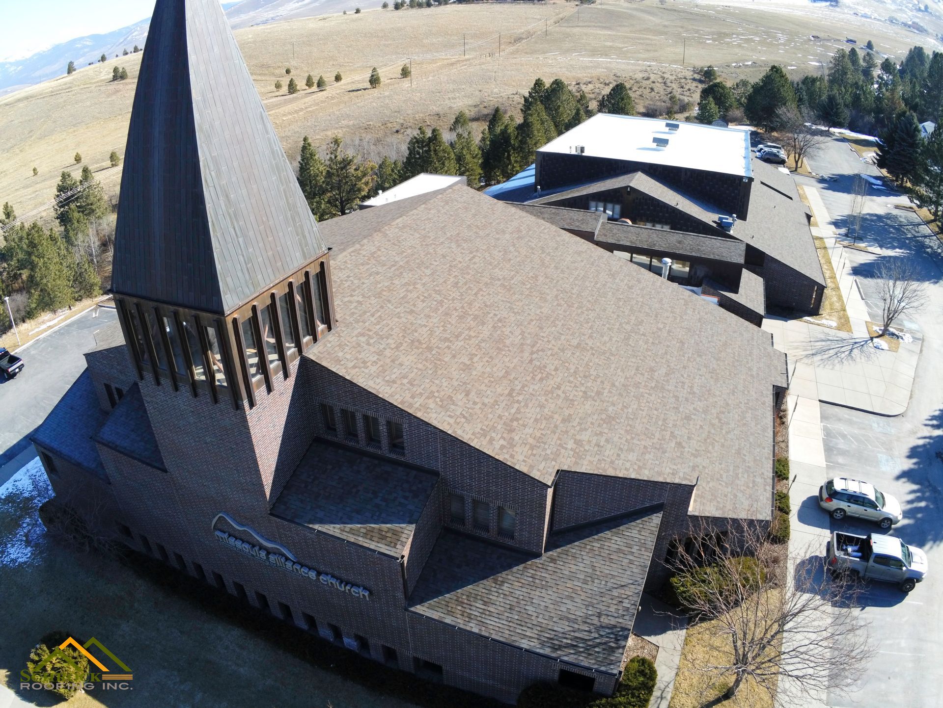 Completed commercial shingle and TPO roofing project at Missoula Alliance Church