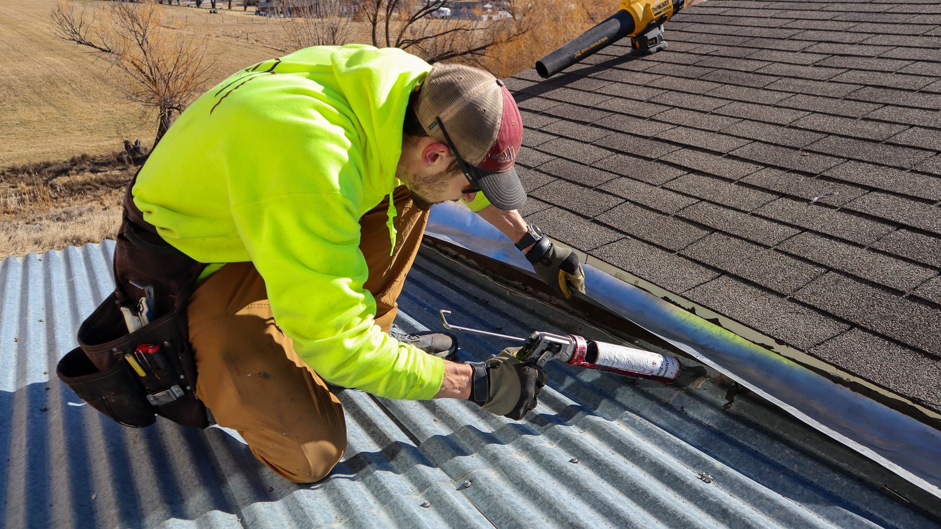 Residential roofer inspecting a shingle roof in Schrock Roofing project imagery for Missoula repair planning
