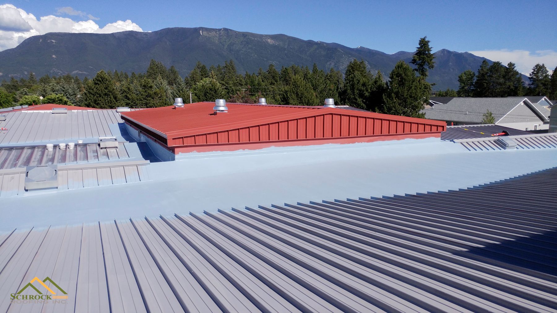 Commercial roof restoration system reinforcing and waterproofing an aging Montana roof