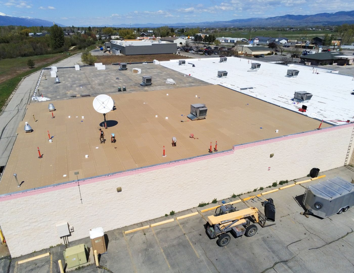 Schrock Roofing commercial roofing crew completing a large-scale roof installation for a Western Montana property