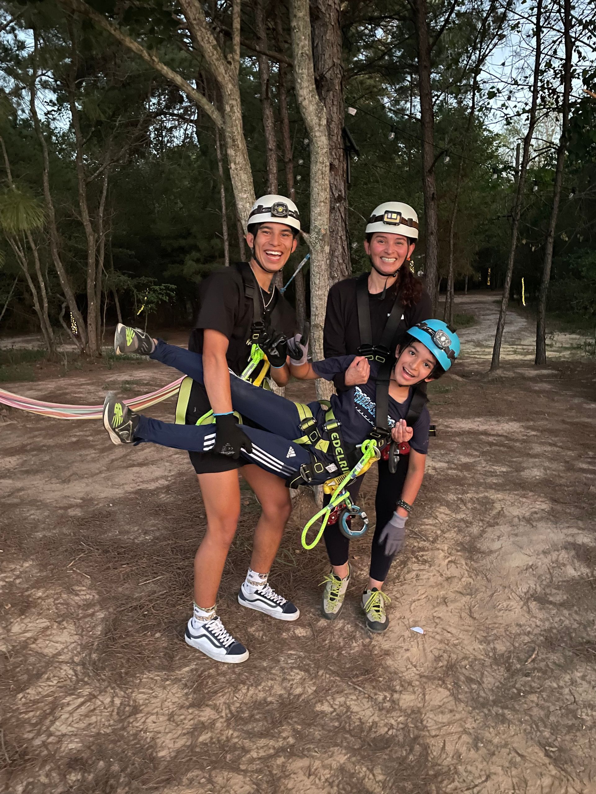 Three kids on night zipping.