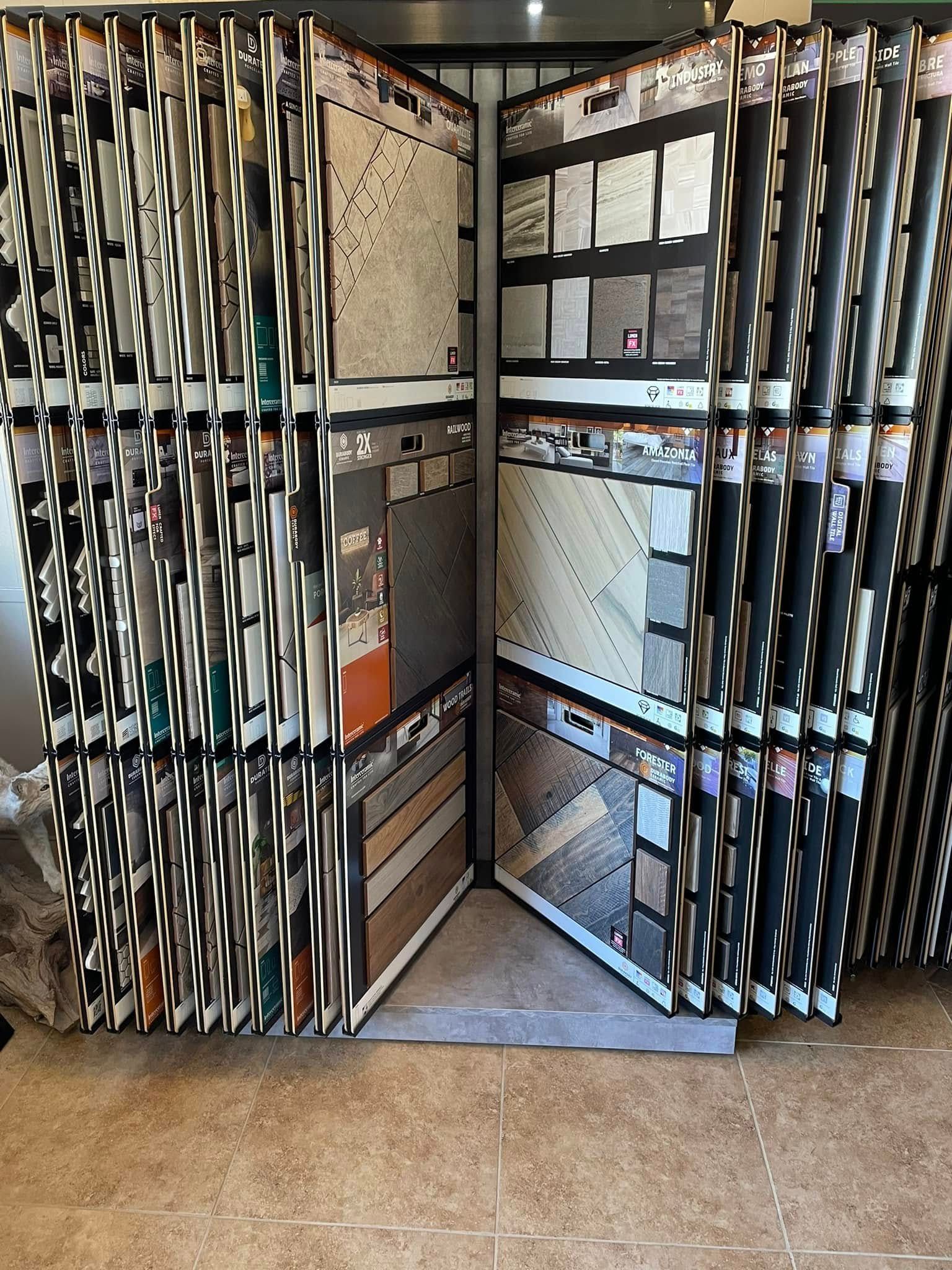 Open cabinet filled with folded papers and mail bins in a hallway