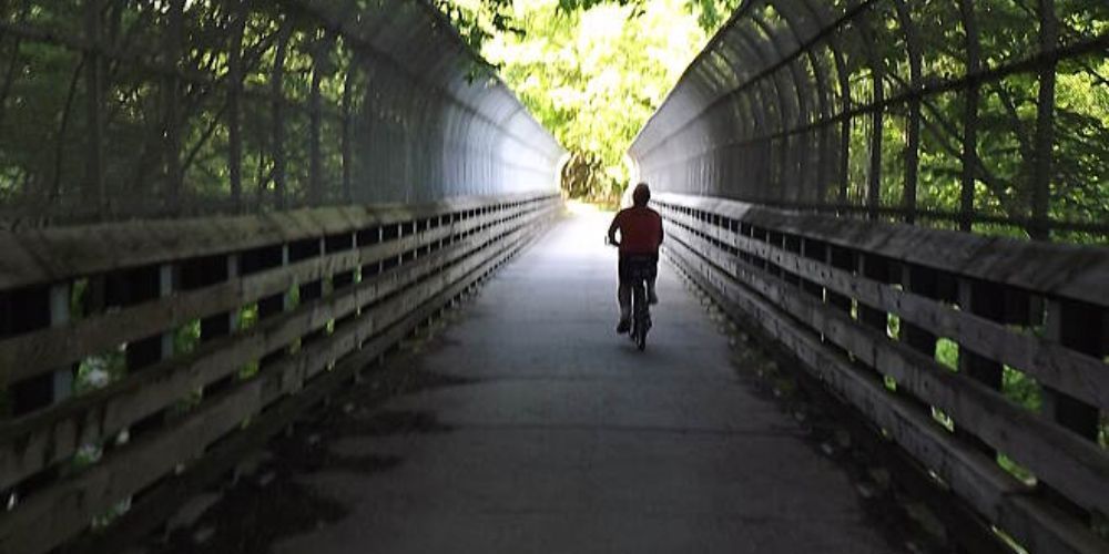 Cyclist biking on a city trail in New Jersey