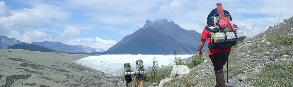 A group of people are hiking up a mountain.