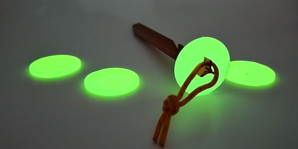 Glow in the dark ping pong balls with a wooden handle