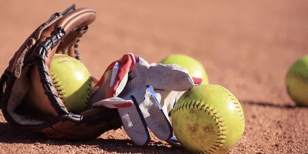 softballs and a softball glove