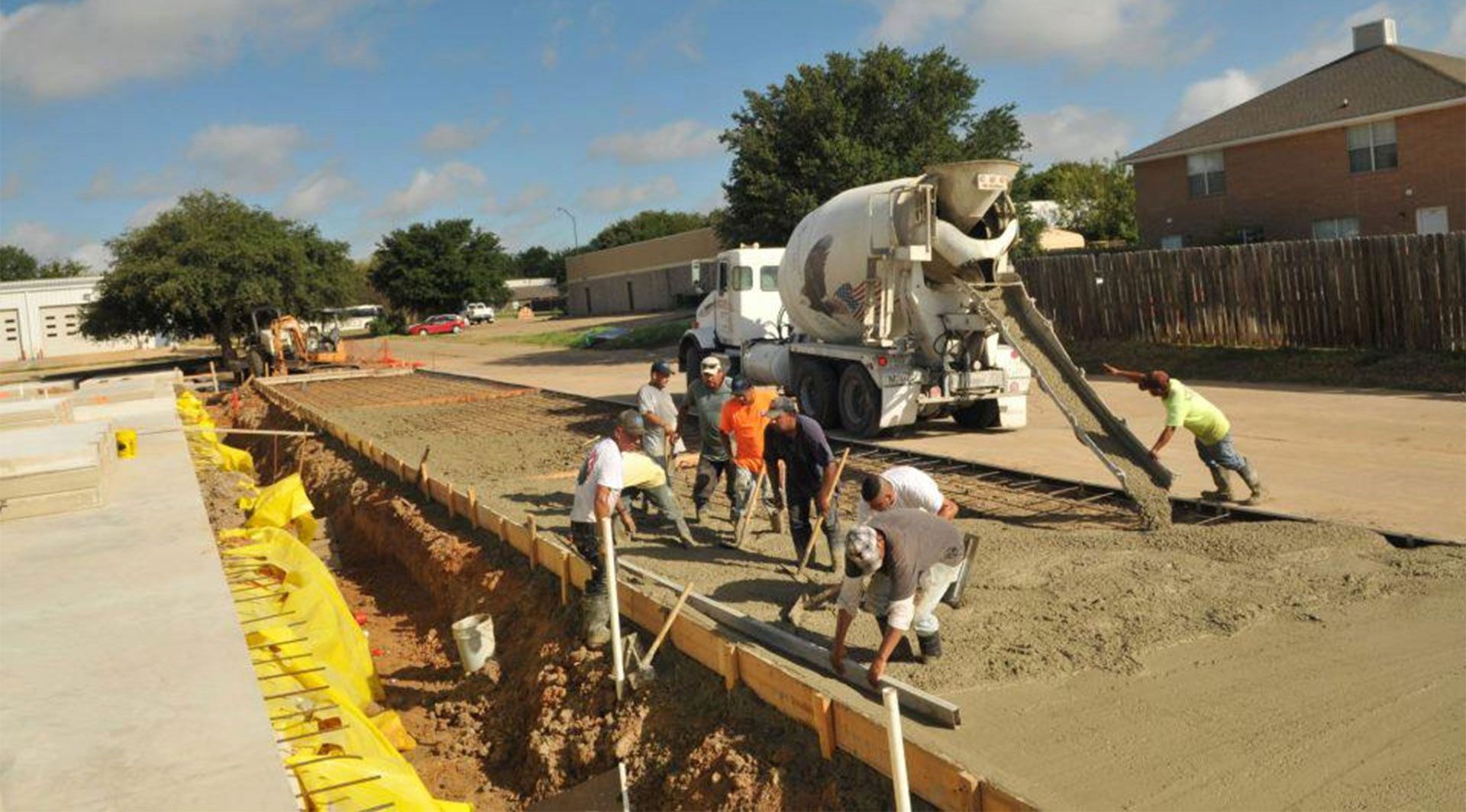 Commercial concrete contractors laying a concrete lot