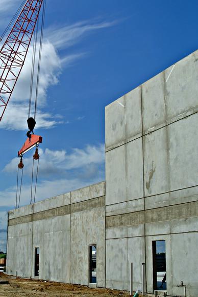 A crane and concrete walls