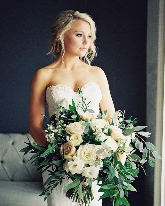 Beautiful bride with bouquet of flowers