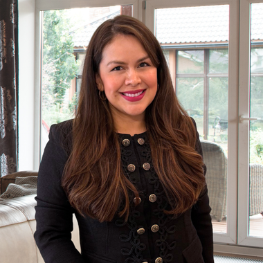 Professional headshot of smiling Esperanza Arias Prada Realtor. Colombiana, Bilingue, Professional, and Honest.