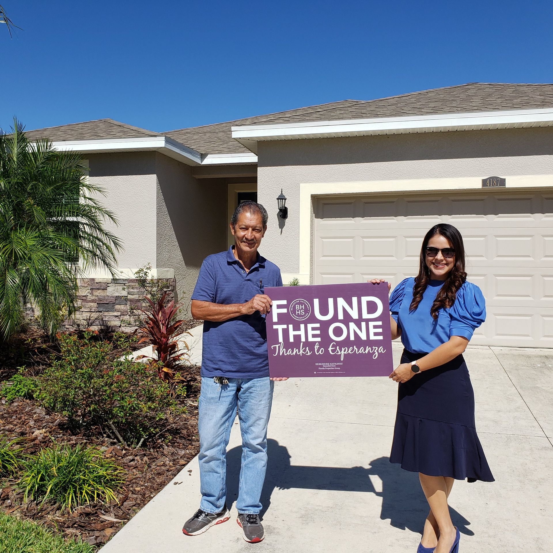 A happy client in front of his relocation home.