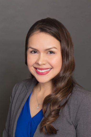 Professional headshot of smiling Esperanza Arias Prada Realtor. Colombiana, Bilingue, Professional, and Honest.