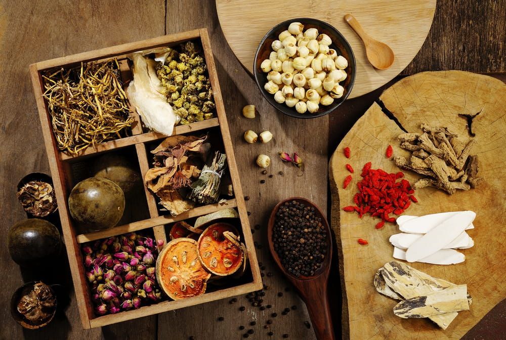 A Wooden Box Filled With Various Herbs — Naturopath Australia In Mermaid Beach, QLD