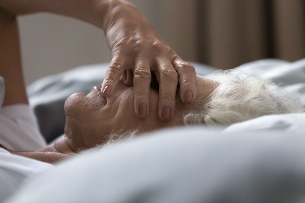Sleepless Old Woman Holding Her Face With His Hand — Naturopath Australia In Mermaid Beach, QLD