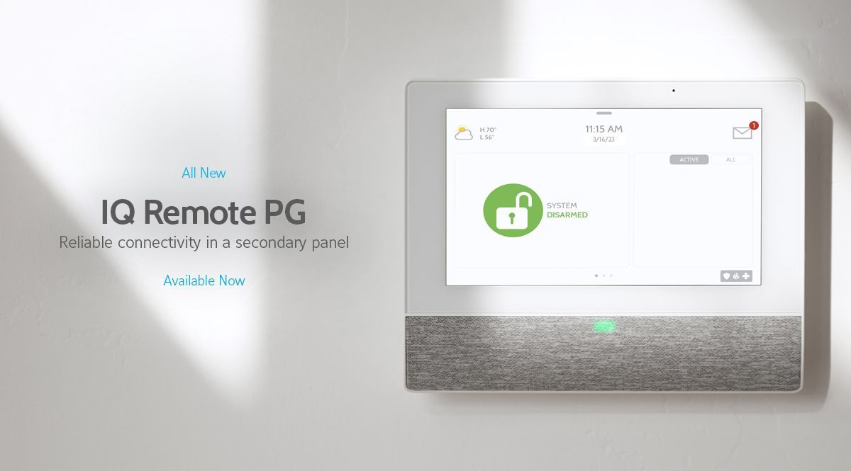 Wall-mounted IQ Remote PG control panel with touchscreen and gray fabric lower section on a white wall.