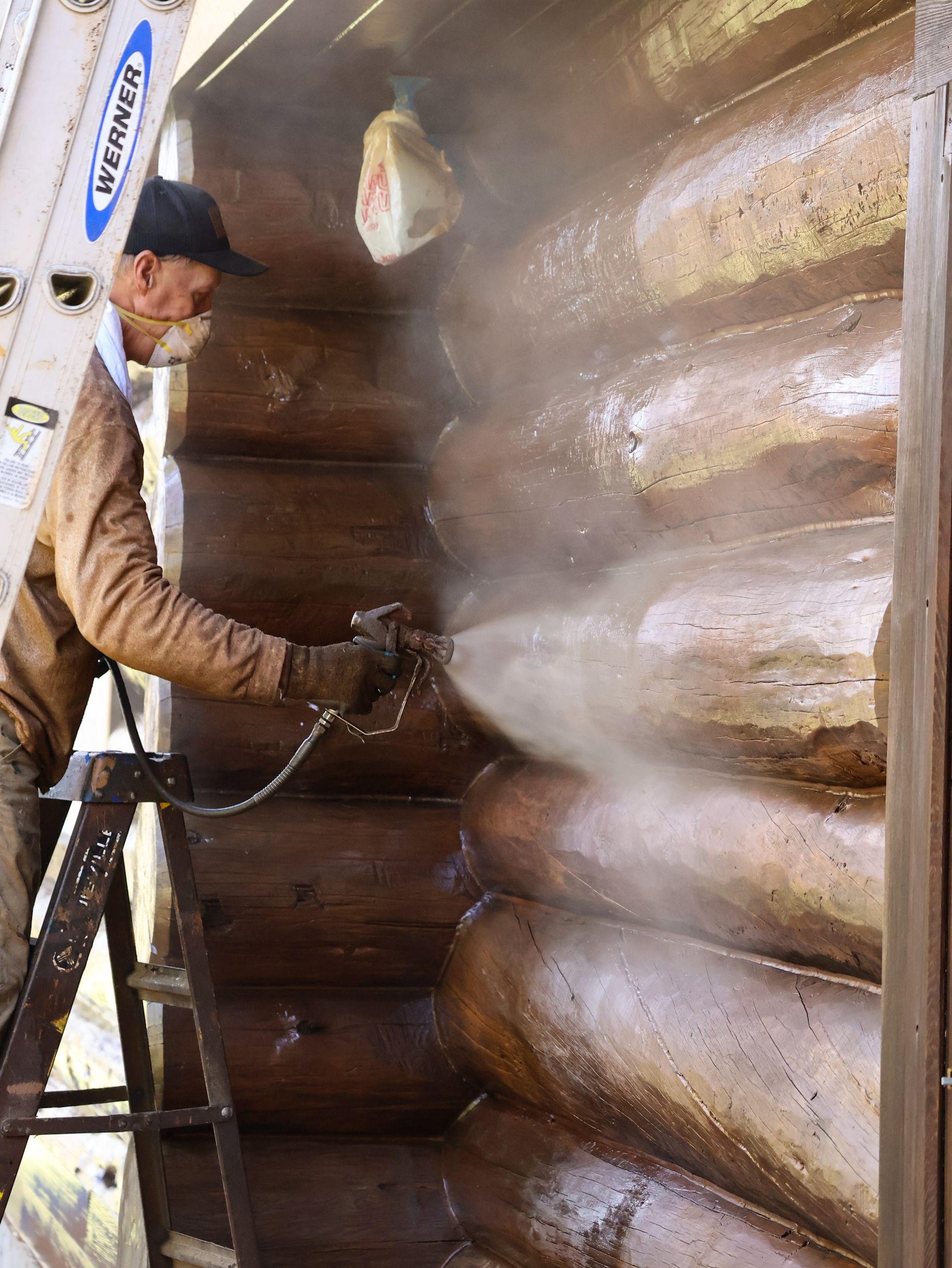 Log home pressure washing and staining services