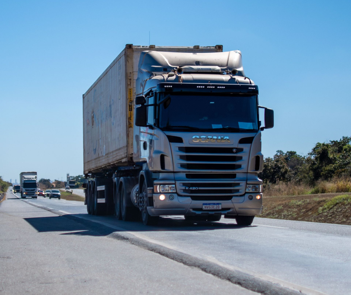 A white freight truck on a highway