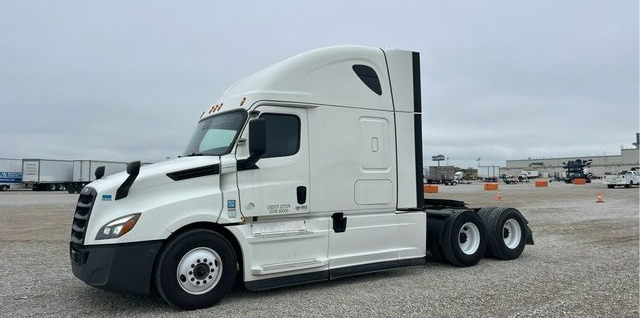A large white freight truck without a trailer.