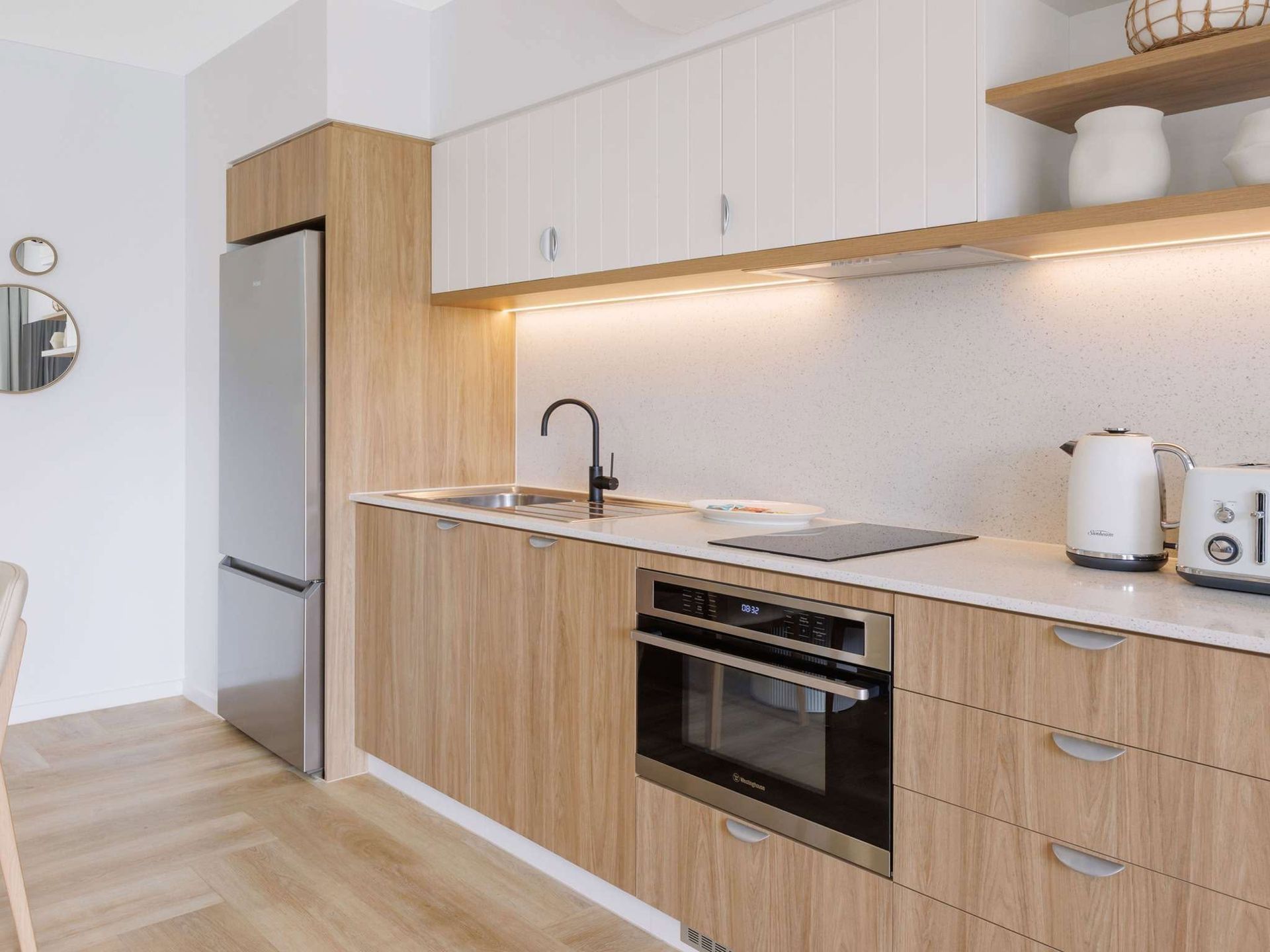 Modern Kitchen With Wood Cabinets and White Countertops — Kitchens by CCJS in Bungalow, QLD