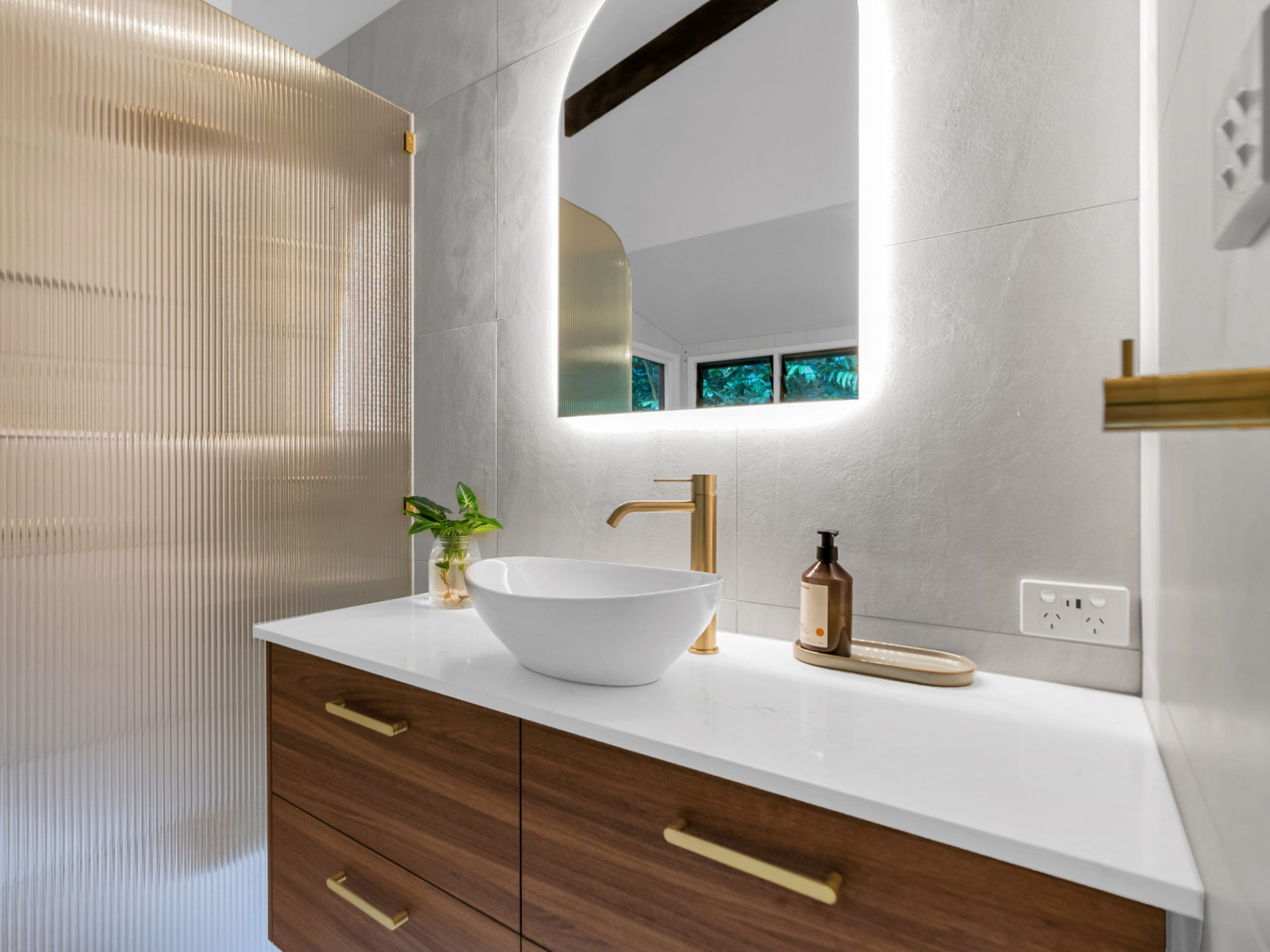 A Bathroom  Sink with Wooden Cabinets And Mirror — Kitchens by CCJS in Bungalow, QLD